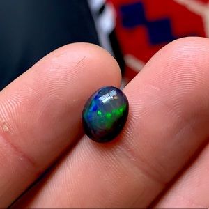 Genuine black opal cabochon